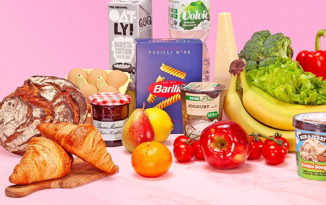 Flink groceries — bread, pasta, fruit and vegetables on the brand&rsquo;s pink